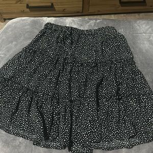 black skirt with white polka dots